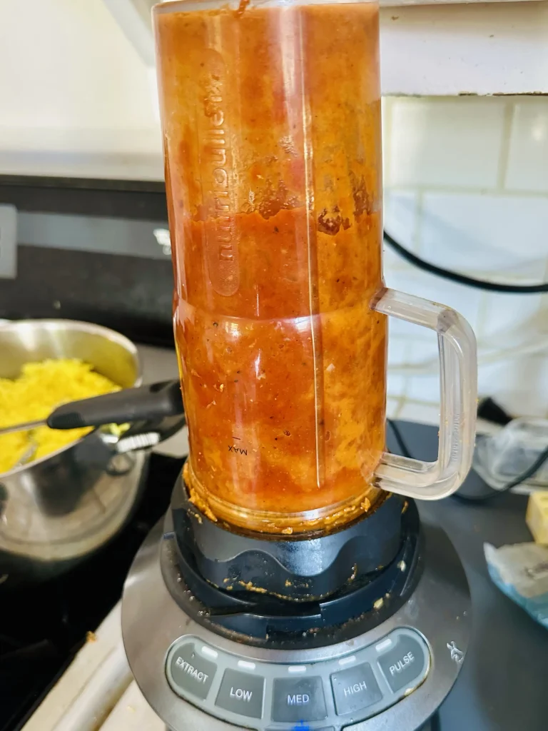 putting curry mix into blender and making it smooth