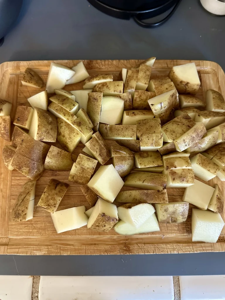 chopped potatoes on a cutting board