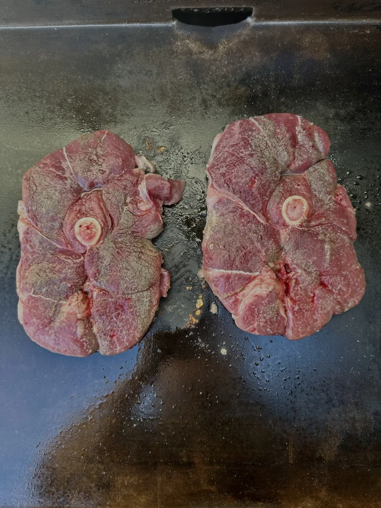 raw lamb chops on the grill