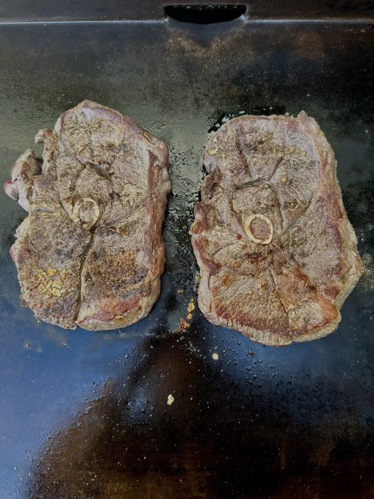 cooked lamb chops on the grill